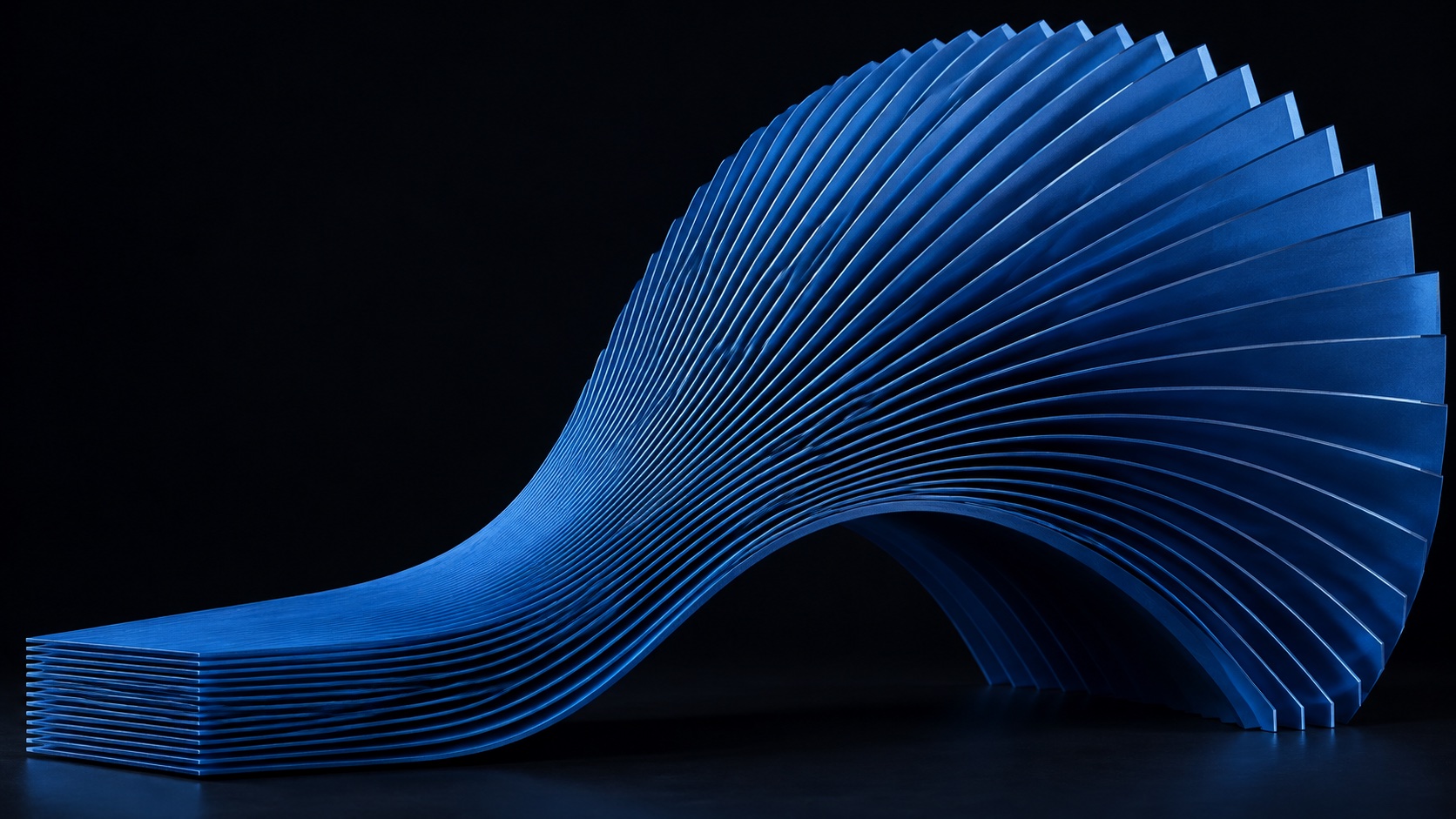 Closely spaced blue layers rise from a compact stack into a broad sculptural arch.