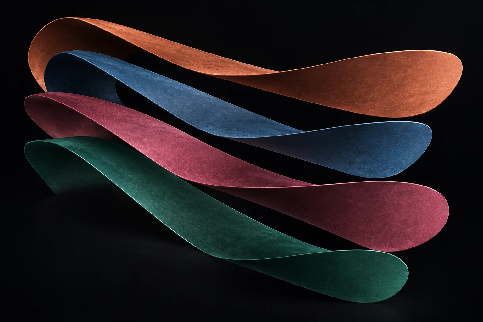 Four sculptural bands twist independently in coral, blue, raspberry and jade, sharing a flowing rhythm against a black background.